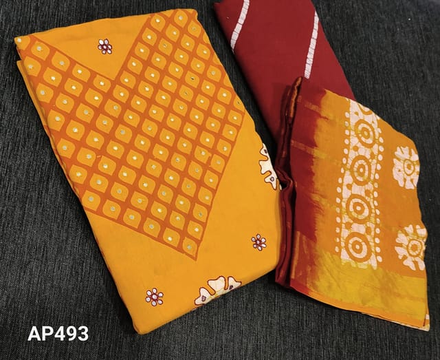 CODE AP493: Batik dyed yellow soft Satin Cotton unstitched salwar material(requires lining) with thread and faux mirror work on front side, batik dyed red cotton bottom.  batik dyed dual shaded soft mul cotton dupatta with zari lines.