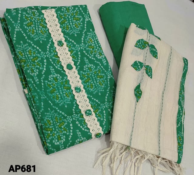 CODE AP681 : Bandhini Printed Green soft Silk Cotton unstitched Salwar material(requires lining) with lace work and buttons on yoke, matching thin soft cotton bottom, applique work on sillk cotton dupatta with tassels.