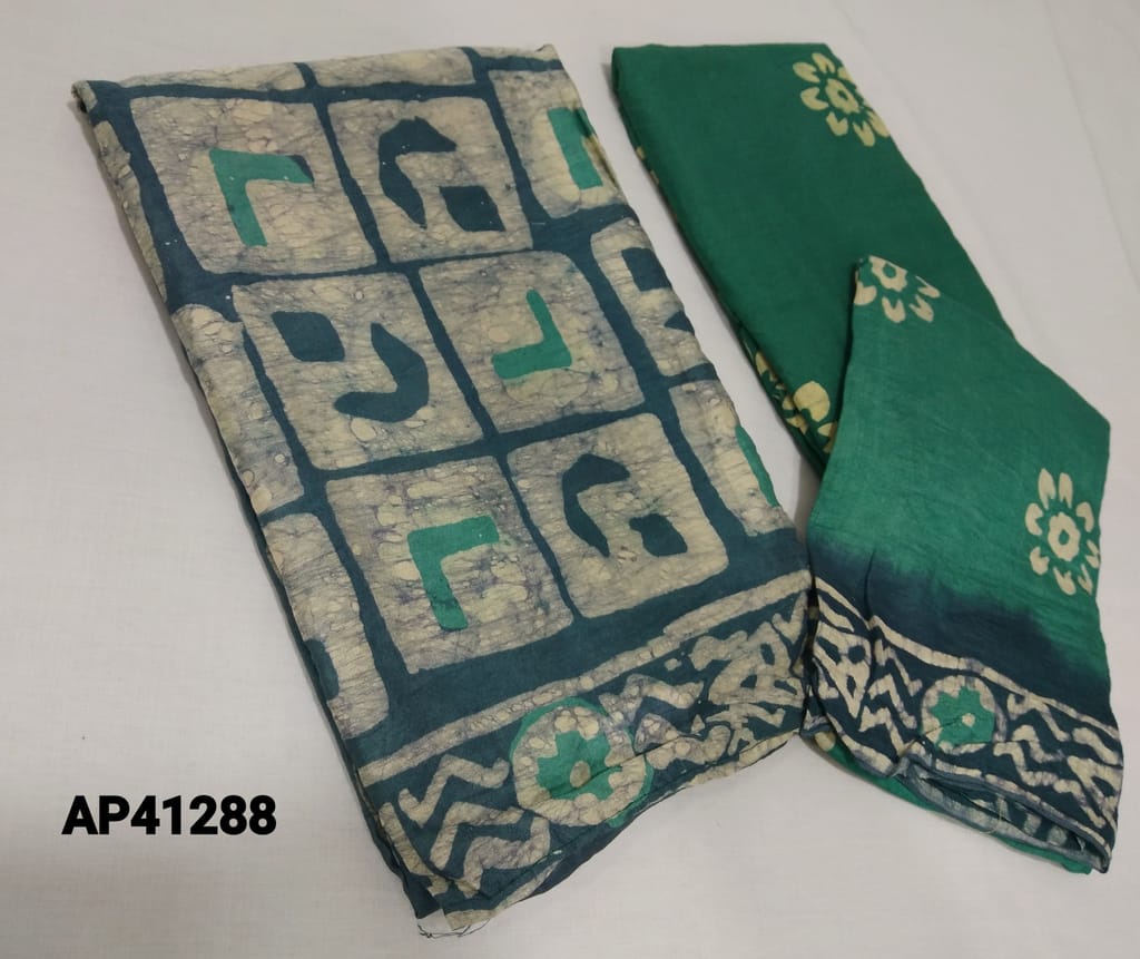 CODE AP1288 : Original Wax batik work on Sober Blue soft silk cotton Unstitched Salwar material(thin fabric requires lining) , Green thin drum dyed cotton bottom with pure wax batik work(there will be color inconsistencies as these are drum dyed) , Wax batik work on silk cotton dupatta(Taping needs to be stitched)
