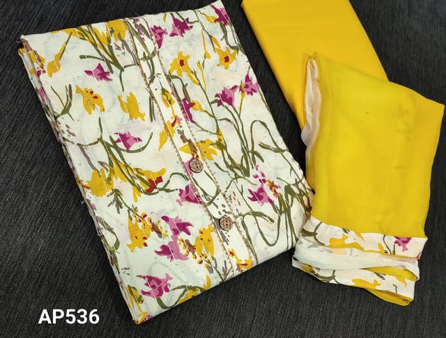 CODE AP536 : Printed White soft Cotton unstitched salwar material( requires lining) with wodden buttons on yoke, thread and sequence work on frontside, bright yellow cotton bottom, Dual Shaded soft chiffon dupatta with tapings.