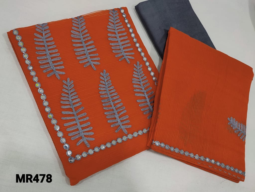 CODE MR478 : Orange Fancy Super Net Silk Cotton Unstitched salwar material (netted fabric, lining requires) with embroidery and foil work on yoke, Blueish Grey silk cotton bottom, embroidery and foil work on super net silk cotton dupatta.