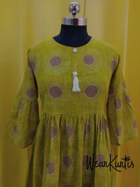 Printed Mehandhi Green Slub Cotton gathered waistline flared Kurti, buttons and tassels on yoke.(Refer Size chart, 3rd pic before ordering, No Refund, No Return, No exchange, No cancellation), Round Neck, Height 44, 3/4 Bell sleeves.