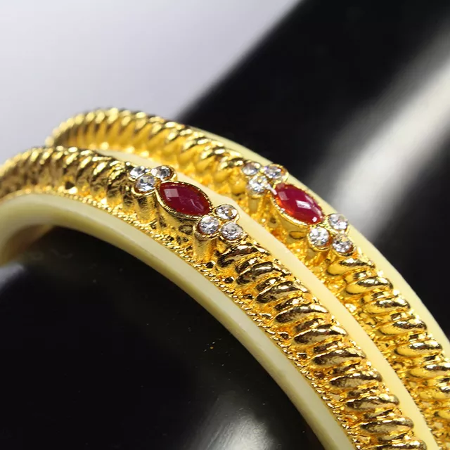 Bone casing look gold Rajmatha-symbolic royal bangles inspired rhinestones and precious studs imitation opulent party wear twin bangle set