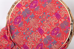 Red muslin fabric with flower print