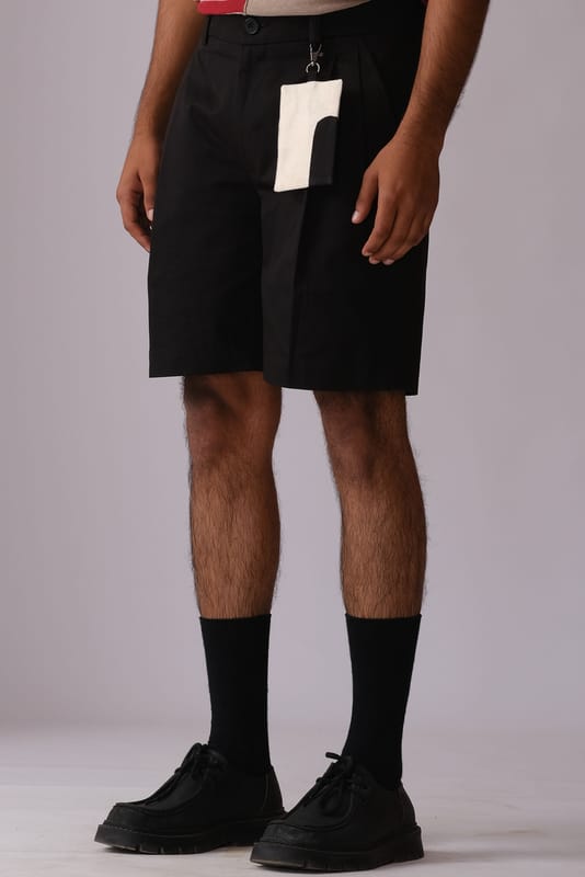 Pleated Shorts with Detachable Human Symbol