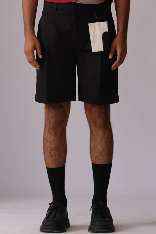 Pleated Shorts with Detachable Human Symbol